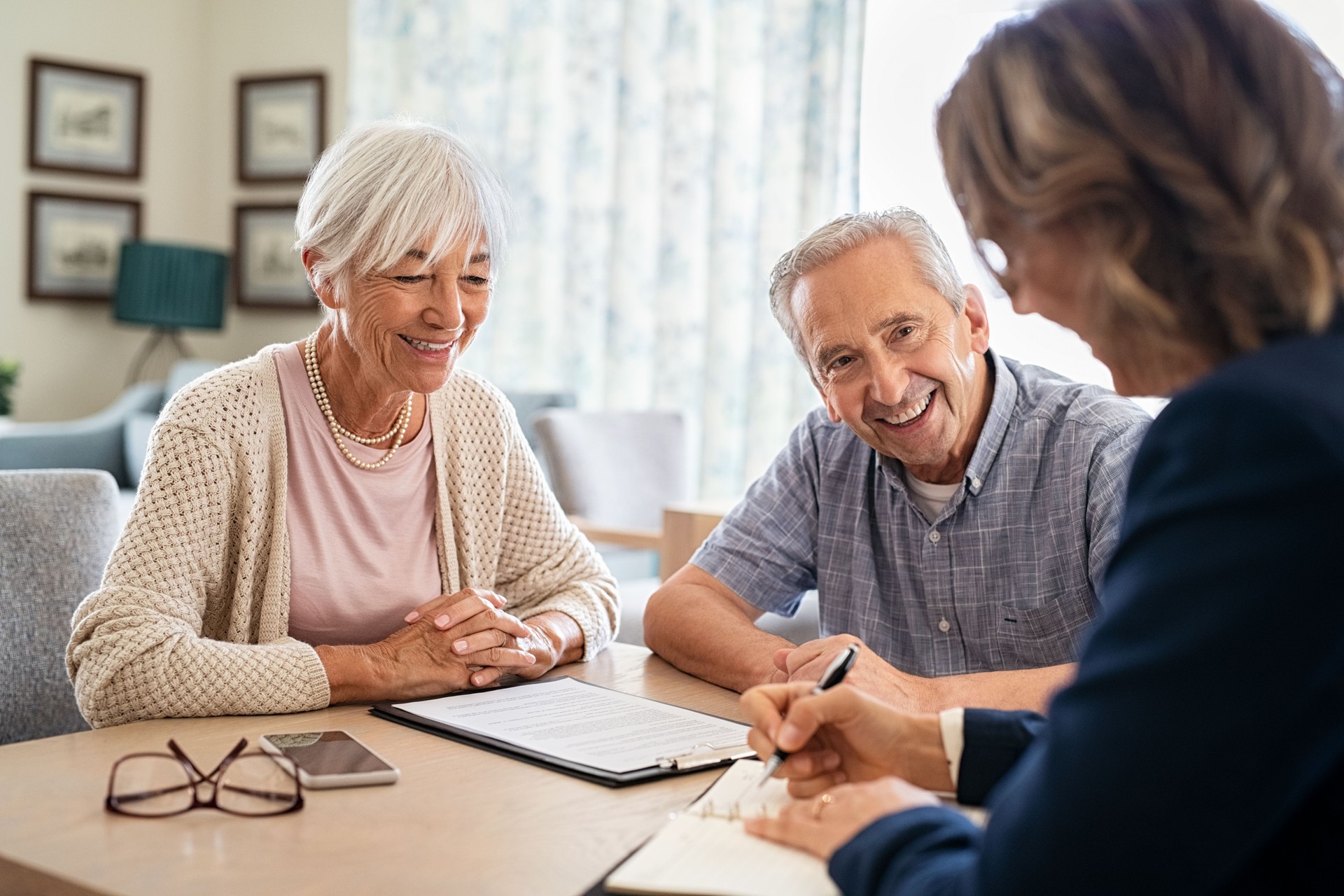 Senior couple consulting with senior citizen placement agent